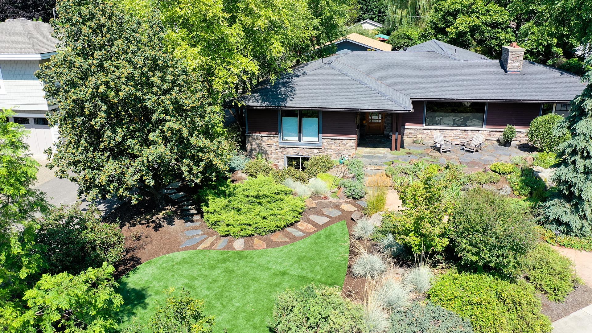 home with lush landscaping and a curvy lawn