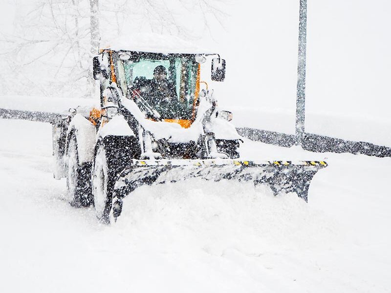 snow plow plowing snow in the snow